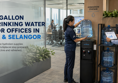 Ace Water staff setting up a 5-gallon drinking water bottle and water dispenser at a modern office in Kuala Lumpur, highlighting reliable workplace drinking water supply for offices in KL and Selangor.