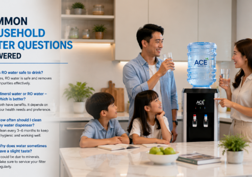 A family gathers around a kitchen water dispenser, enjoying clean drinking water while discussing common household water questions. The scene highlights safe hydration, water dispenser use, and informed choices for healthy drinking water at home.