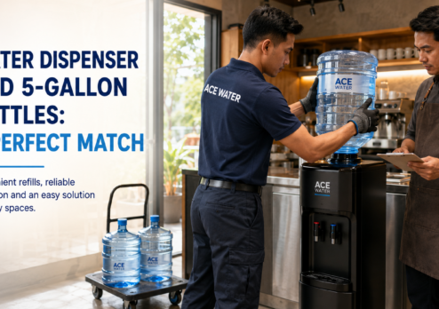 Ace Water staff installs a 5-gallon water bottle onto a water dispenser in a busy commercial space, highlighting the convenient combination of a water dispenser and 5-gallon bottles for reliable, easy access to drinking water.